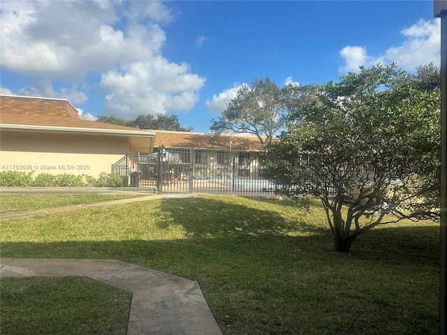 view of yard featuring a gate and fence