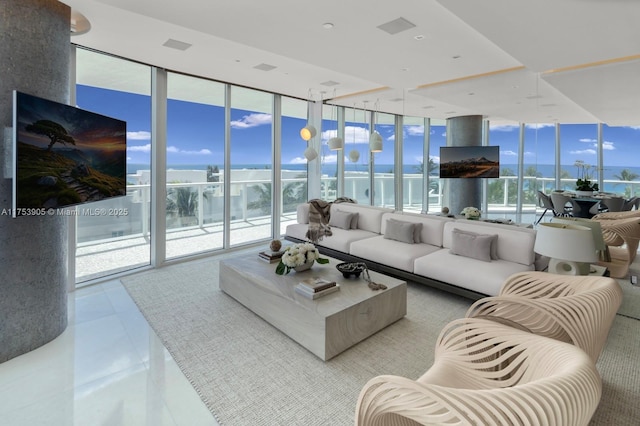 living room featuring floor to ceiling windows