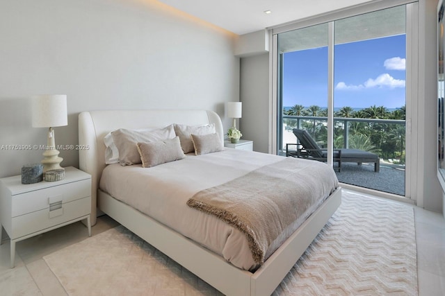 bedroom featuring access to exterior and floor to ceiling windows