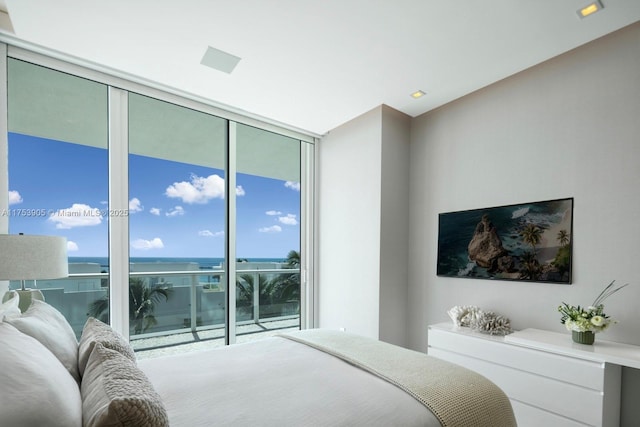 bedroom featuring a wall of windows