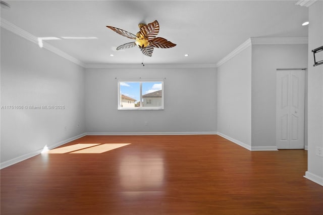unfurnished room featuring wood finished floors, a ceiling fan, and ornamental molding