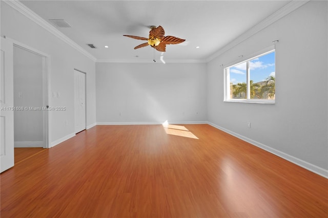 spare room with recessed lighting, light wood-style floors, a ceiling fan, and baseboards