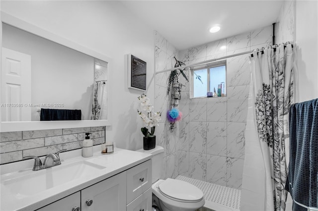 full bath featuring toilet, a shower stall, and vanity