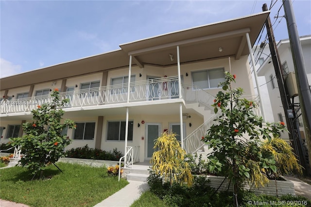 view of front of home with a porch and stucco siding