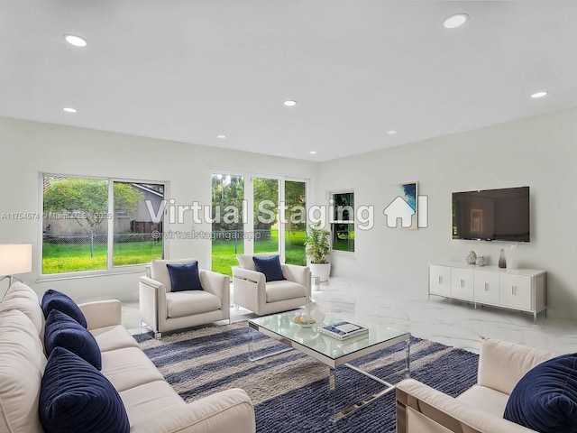 living area featuring marble finish floor, french doors, and recessed lighting