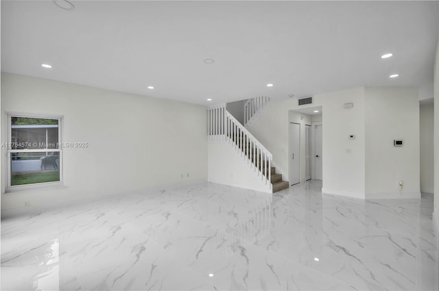 spare room featuring stairs, marble finish floor, visible vents, and recessed lighting