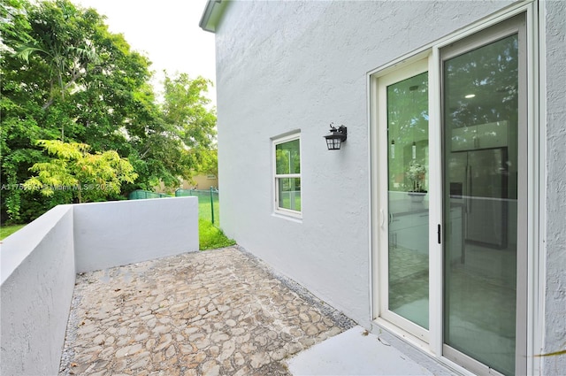 view of patio featuring fence