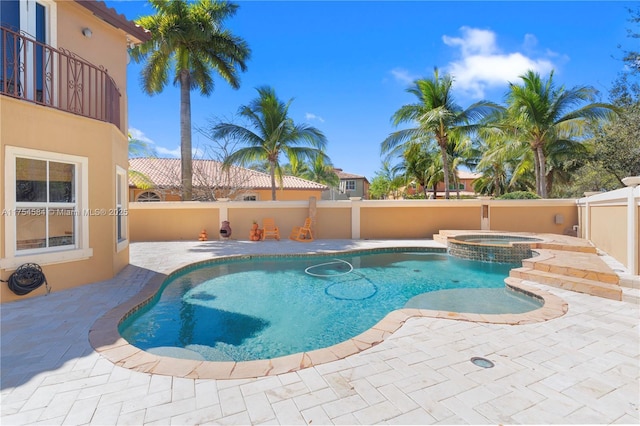 view of pool featuring an in ground hot tub, a patio area, a fenced backyard, and a fenced in pool