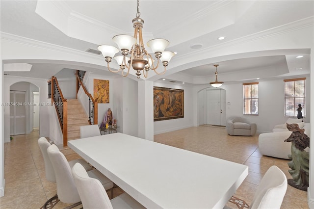 dining space with arched walkways, light tile patterned floors, visible vents, stairway, and a tray ceiling