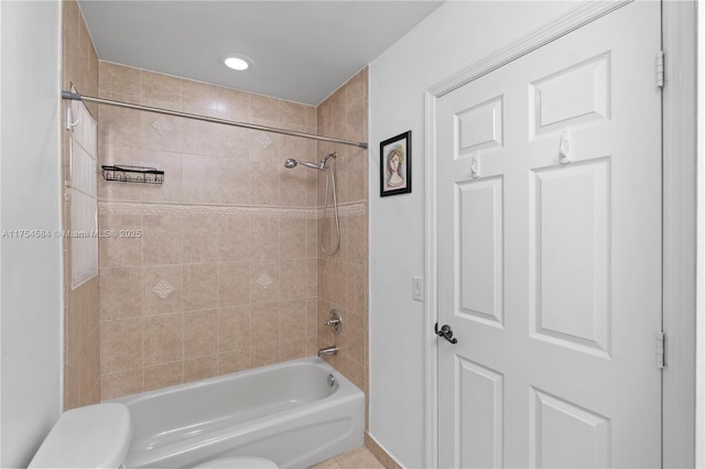 full bathroom featuring tub / shower combination and toilet