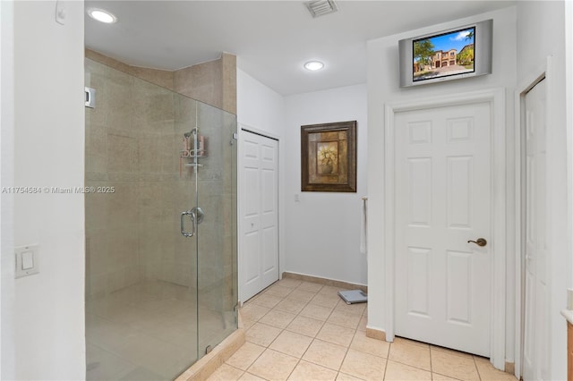 bathroom with tile patterned flooring, recessed lighting, visible vents, baseboards, and a stall shower