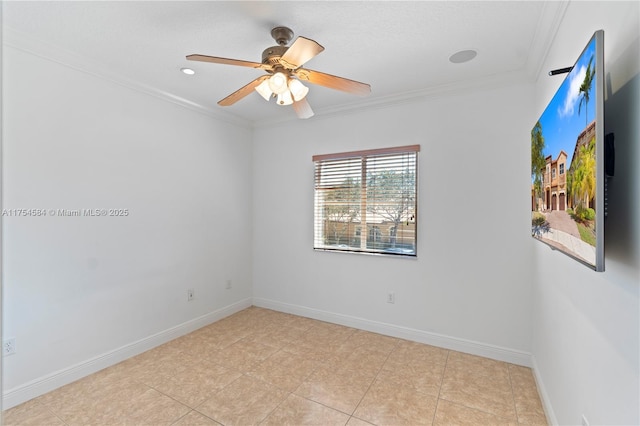 spare room featuring a ceiling fan, light tile patterned floors, baseboards, and crown molding