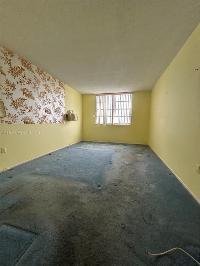 unfurnished room featuring carpet flooring