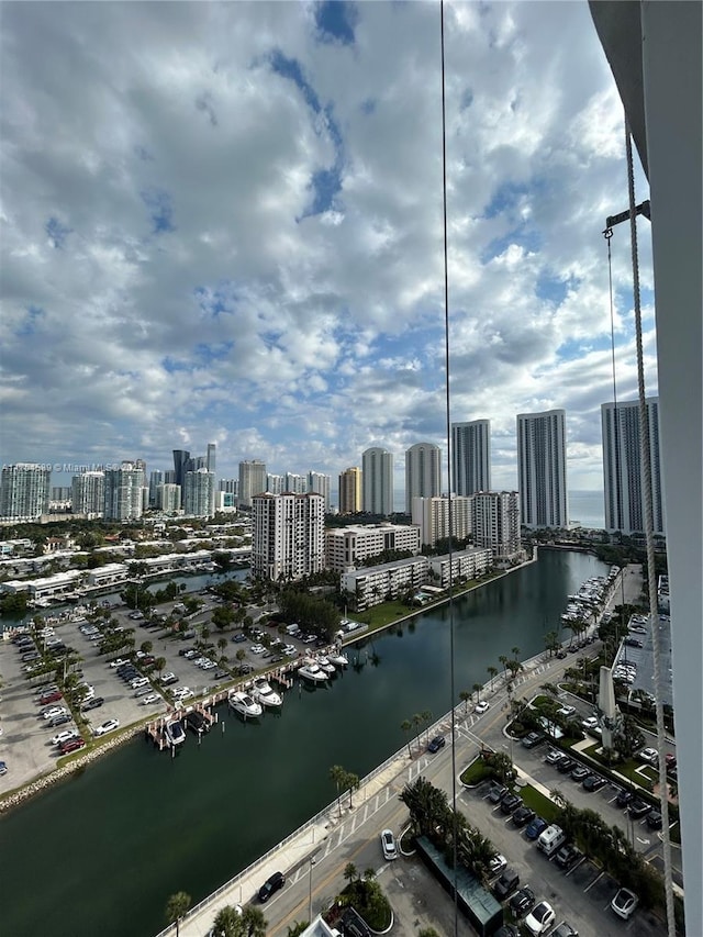 exterior space featuring a water view and a view of city