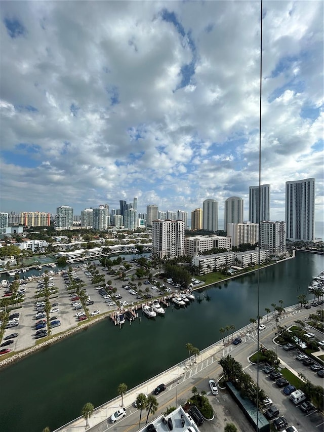 drone / aerial view with a view of city and a water view