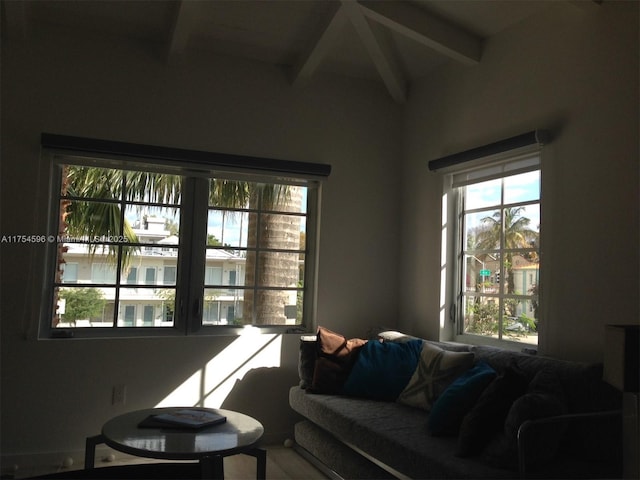 sitting room featuring beamed ceiling