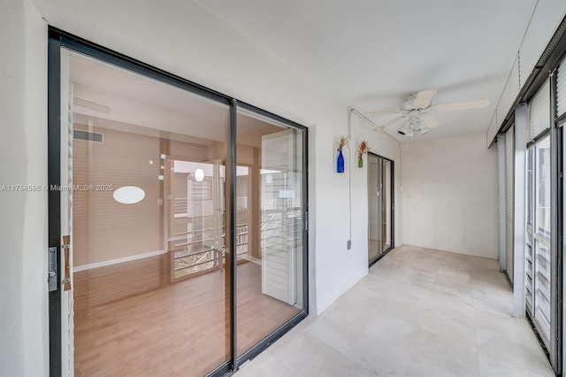 interior space with a ceiling fan