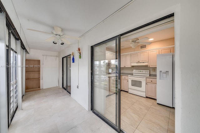 interior space with visible vents and a ceiling fan