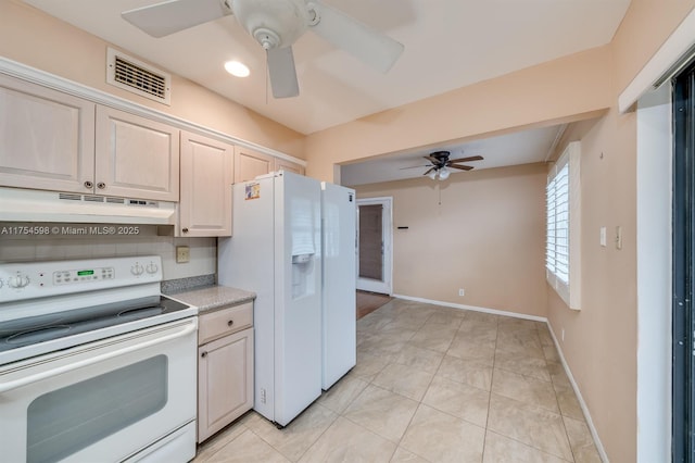 kitchen featuring light countertops, visible vents, white appliances, under cabinet range hood, and baseboards