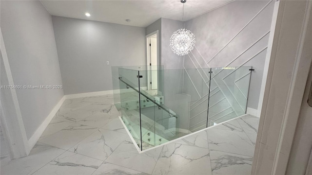 bathroom featuring marble finish floor, baseboards, a notable chandelier, and recessed lighting