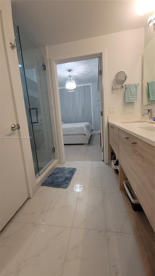 full bathroom with ensuite bathroom, marble finish floor, a shower stall, and vanity