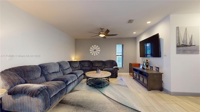 living room featuring recessed lighting, visible vents, ceiling fan, light wood-type flooring, and baseboards