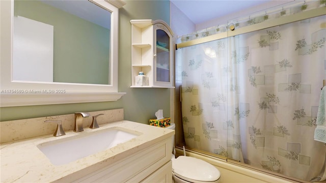 bathroom featuring shower / tub combo, vanity, and toilet