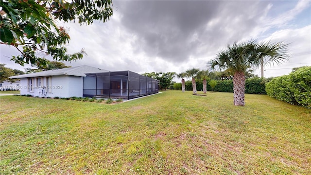 view of yard featuring glass enclosure