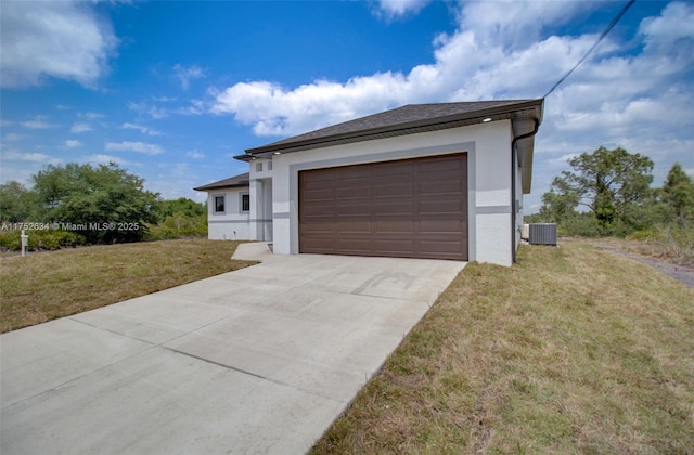 garage with driveway and central AC