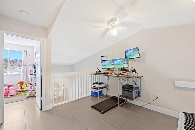 tiled home office featuring baseboards, a ceiling fan, and vaulted ceiling