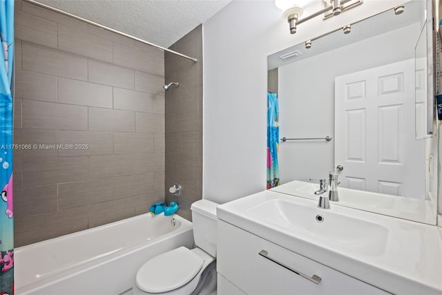 bathroom with visible vents, toilet, shower / bath combo with shower curtain, vanity, and a textured ceiling