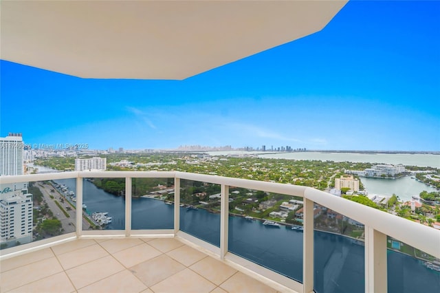 balcony featuring a water view and a view of city