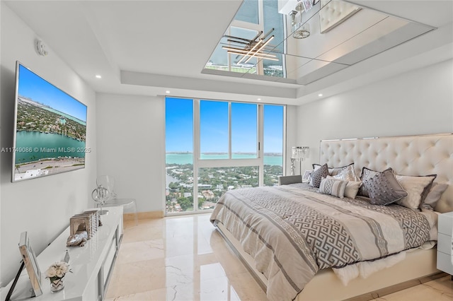 bedroom featuring marble finish floor and recessed lighting