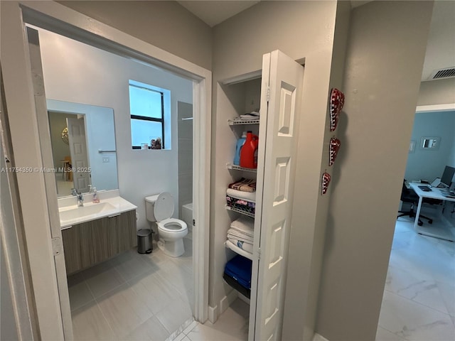 full bath featuring visible vents, vanity, and toilet