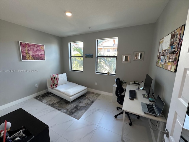 office space featuring marble finish floor and baseboards