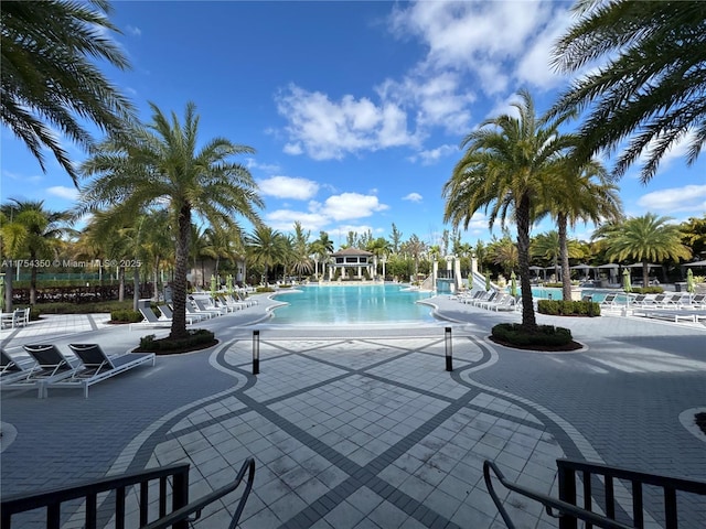 community pool with a patio area