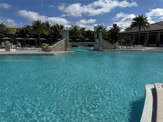 community pool with a patio area