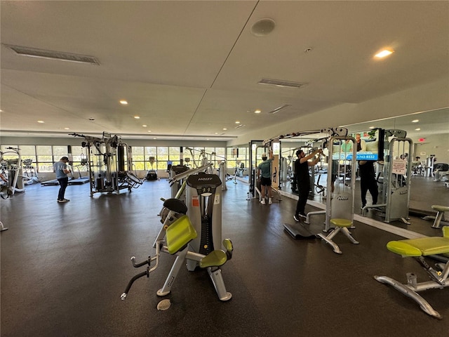 exercise room with visible vents and recessed lighting