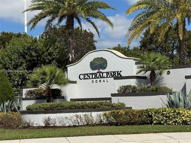 community / neighborhood sign with fence