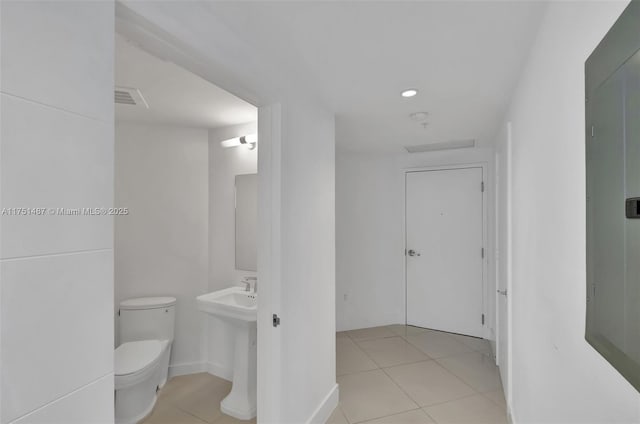 1010 SW 2nd Ave Unit Lph05, Miami, FL 33130 - bathroom featuring tile patterned flooring, toilet, and recessed lighting