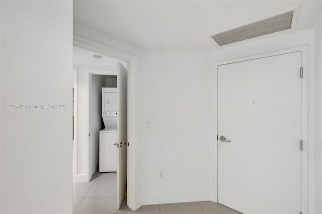 1010 SW 2nd Ave Unit Lph05, Miami, FL 33130 - hallway with stacked washer and clothes dryer and light tile patterned floors