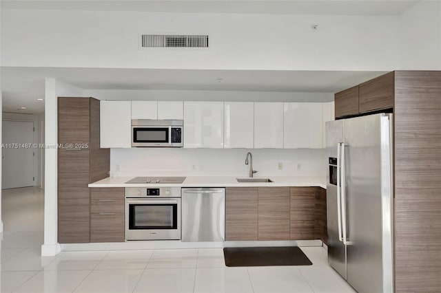 1010 SW 2nd Ave Unit Lph05, Miami, FL 33130 - kitchen with appliances with stainless steel finishes, a sink, light countertops, and light tile patterned flooring
