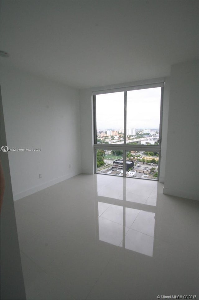 empty room featuring tile patterned floors