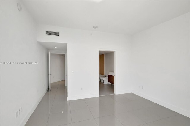 1010 SW 2nd Ave Unit Lph05, Miami, FL 33130 - tiled empty room featuring baseboards