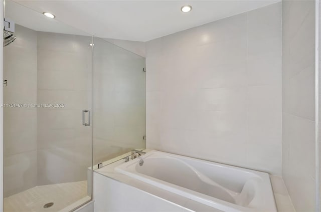 1010 SW 2nd Ave Unit Lph05, Miami, FL 33130 - bathroom with a garden tub, a shower stall, and recessed lighting