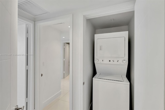 1010 SW 2nd Ave Unit Lph05, Miami, FL 33130 - laundry room featuring stacked washer / drying machine and light tile patterned floors