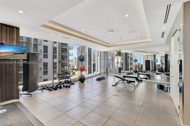 1010 SW 2nd Ave Unit Lph05, Miami, FL 33130 - exercise room featuring floor to ceiling windows, a raised ceiling, and a view of city