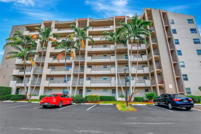 view of property featuring uncovered parking