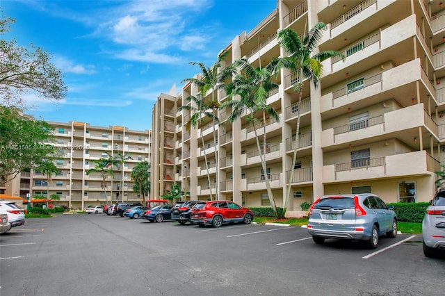 view of property featuring uncovered parking