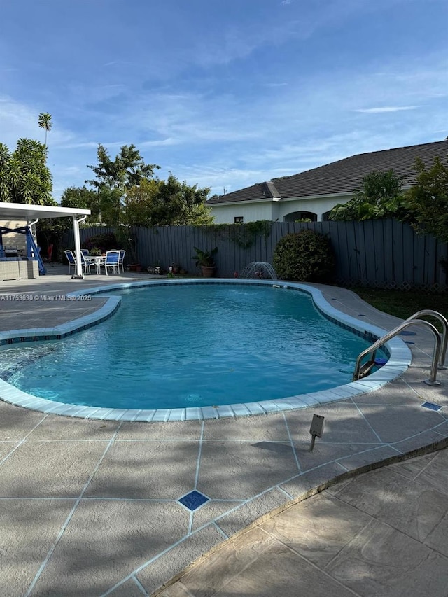 view of swimming pool with a fenced in pool, a patio area, and a fenced backyard